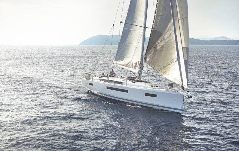 Beneteau 440 sailing under full canvas